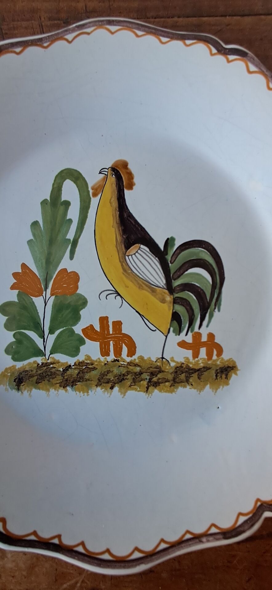 Decorative plate in the 18th-century style. Decoration of a stylised rooster.