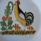 Decorative plate in the 18th-century style. Decoration of a stylised rooster.
