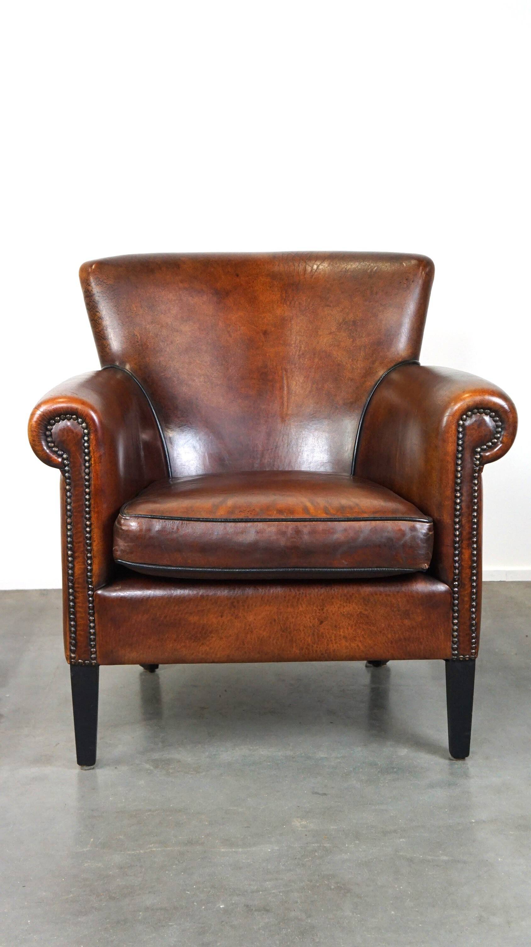 Stylish sheepskin leather armchair with a refined appearance