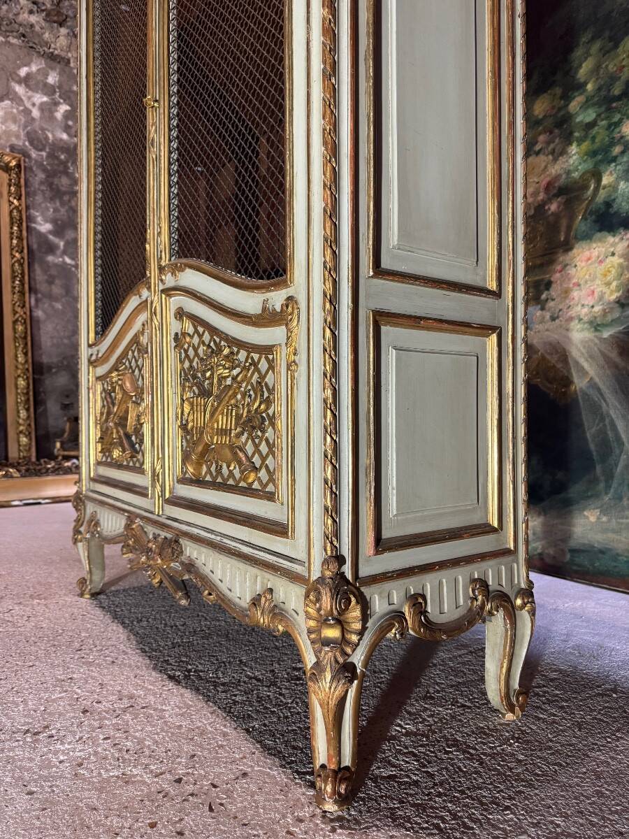 Bookcase in gilded wood and restored wood from the Napoleonic III period.