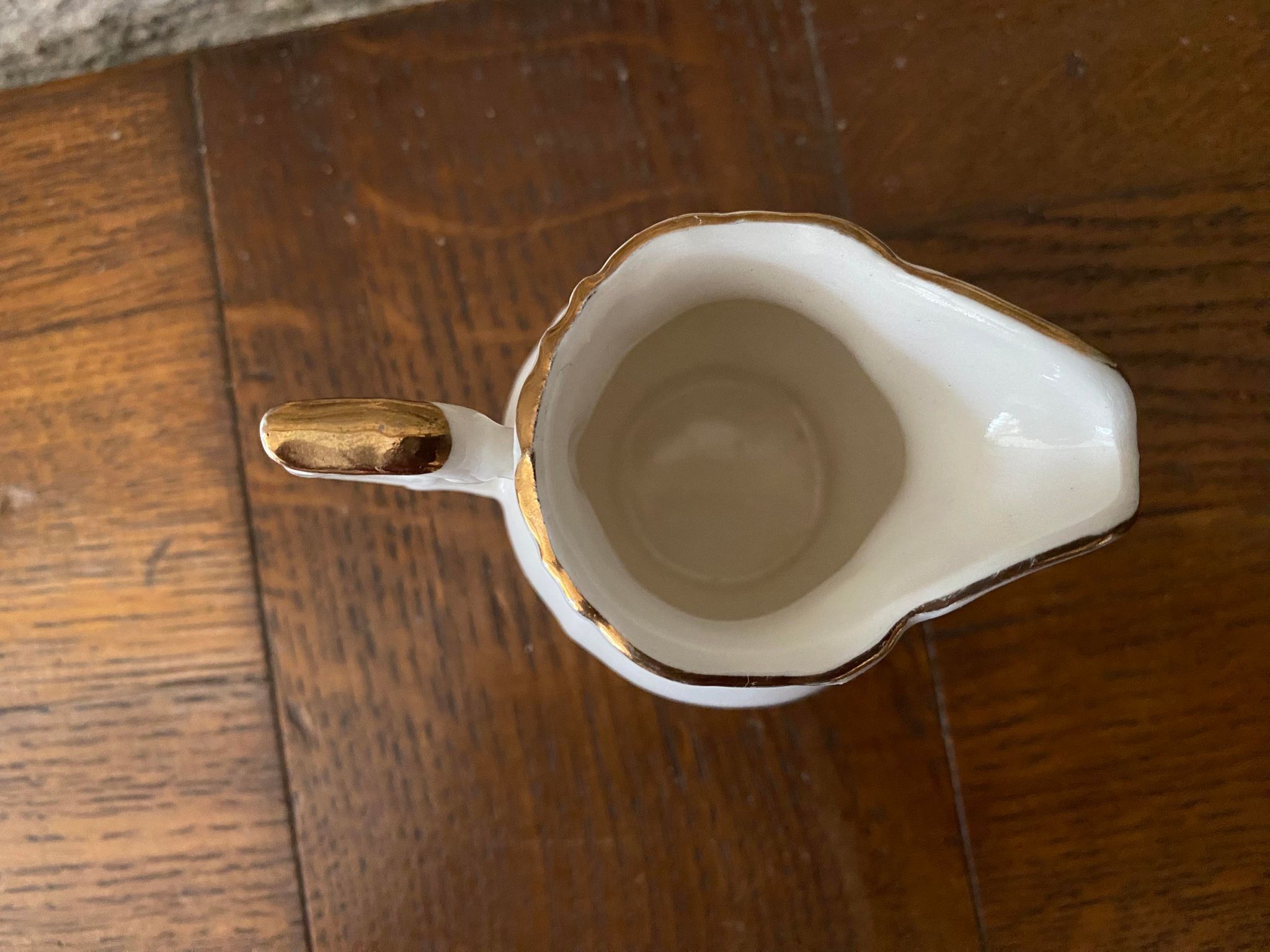 Small milk jug or creamer decoration flowers and golden edge