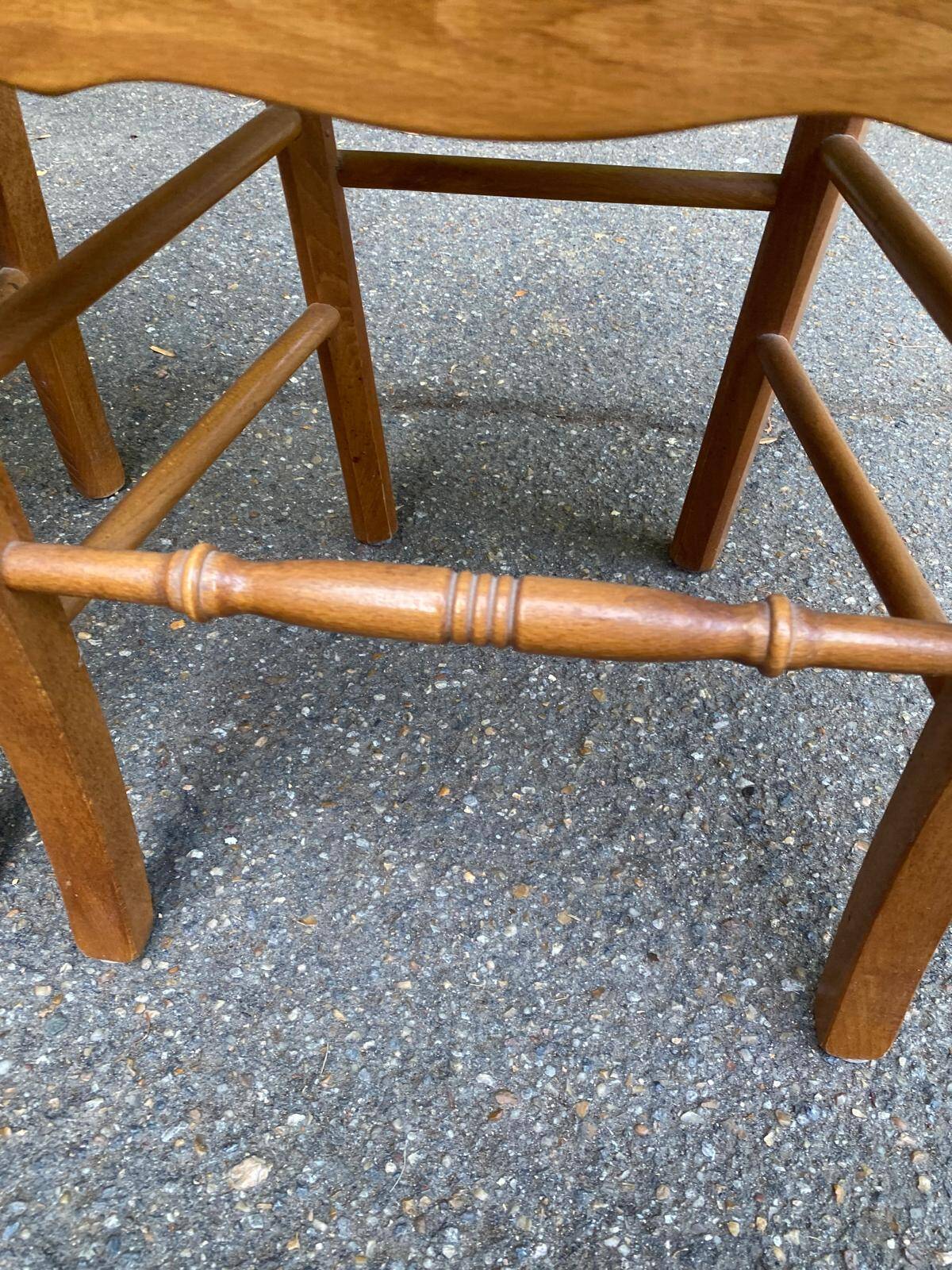 2 wooden dining chairs with rush seats from the 1970s.