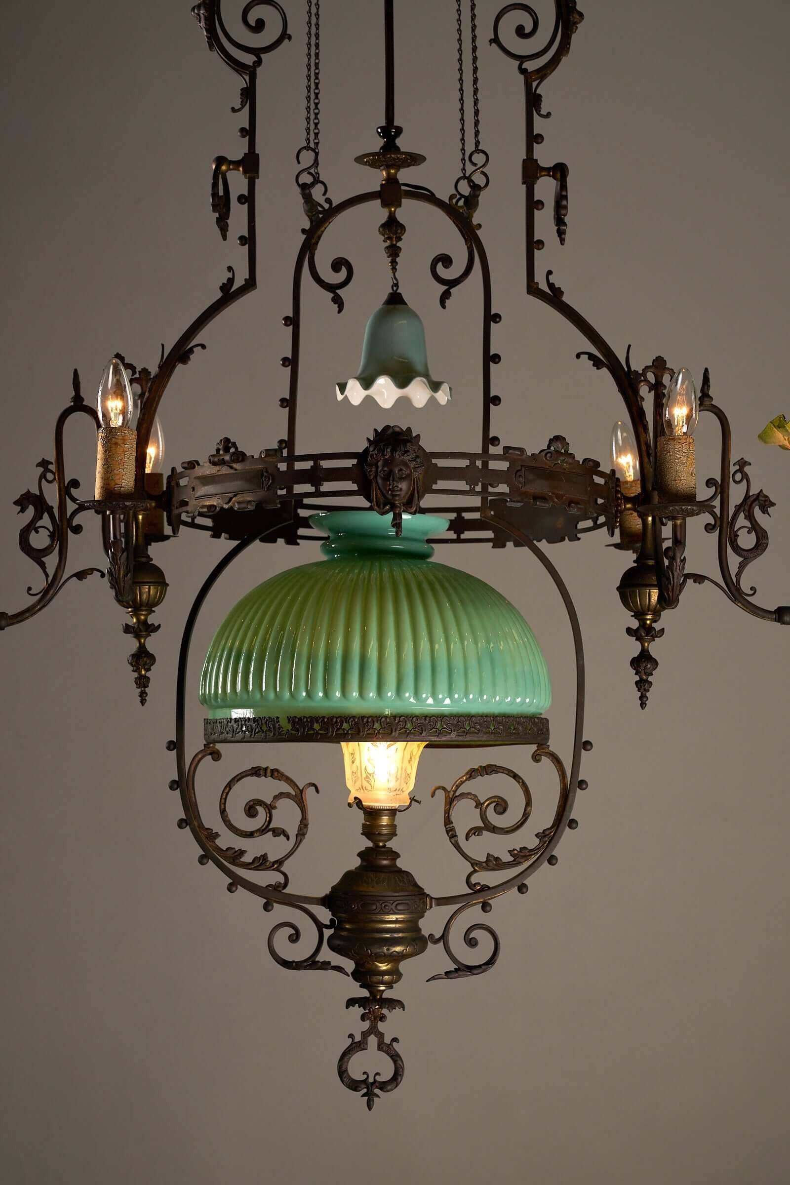 Antique adjustable height chandelier with original glasswork and brass detailing