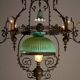 Antique adjustable height chandelier with original glasswork and brass detailing