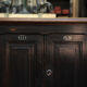 1930s Oak furniture with 2 black patinated doors.