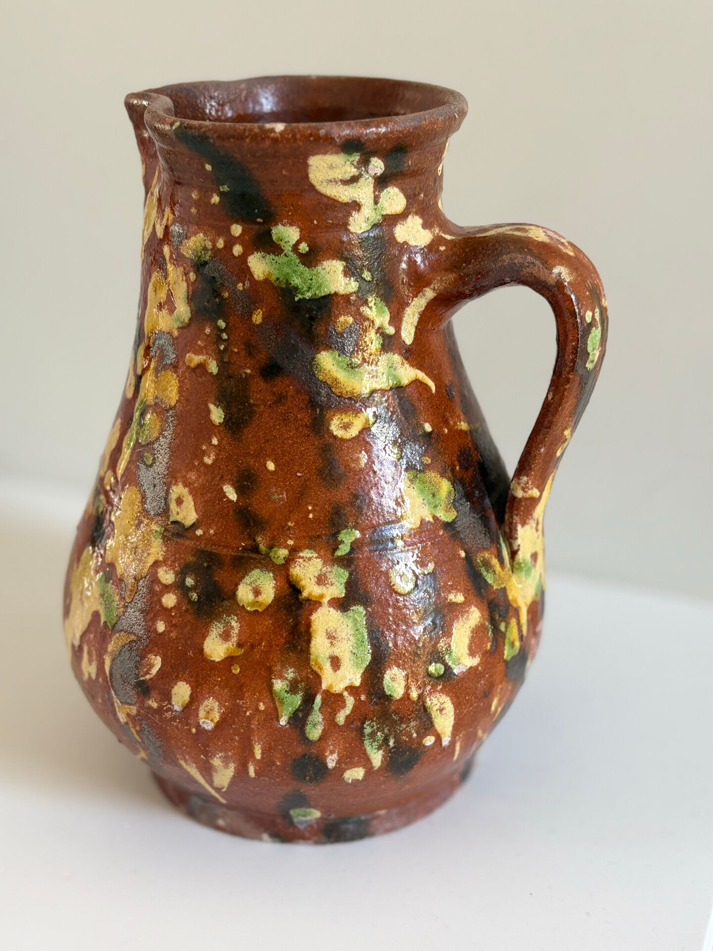 Studio ceramic pitcher with sprayed glazes – circa 1960-70