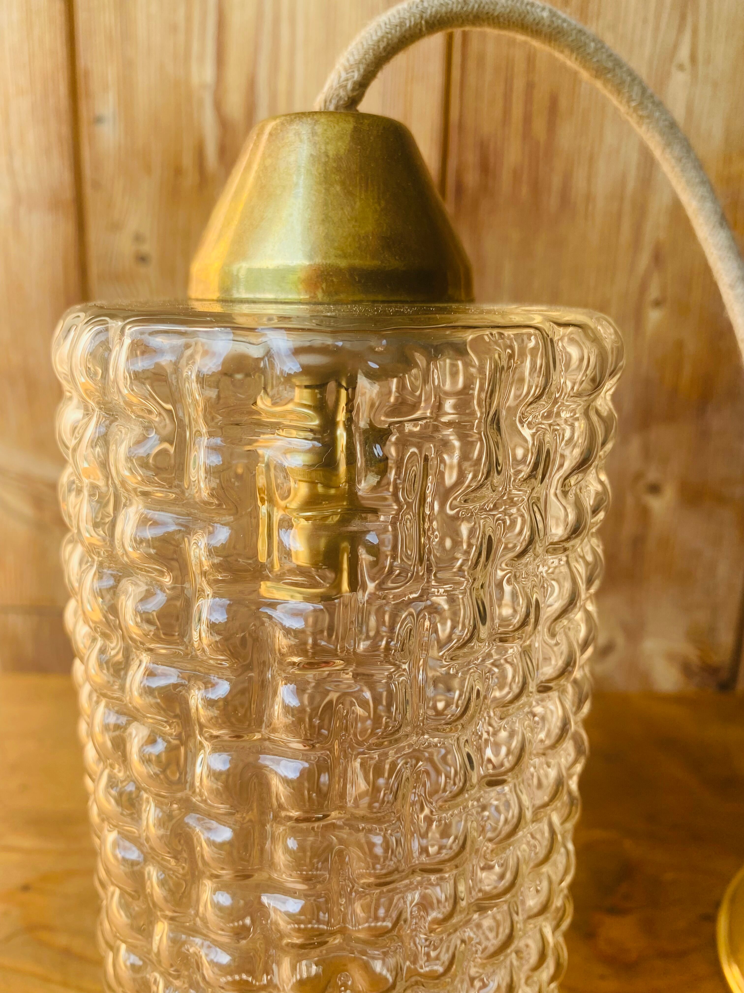 Glass and brass suspension.