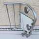 Vintage train style wall-mounted hat rack with angled mirror.