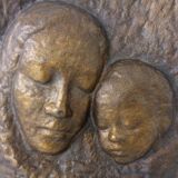 German bronze relief of mother with baby, 1940s.
