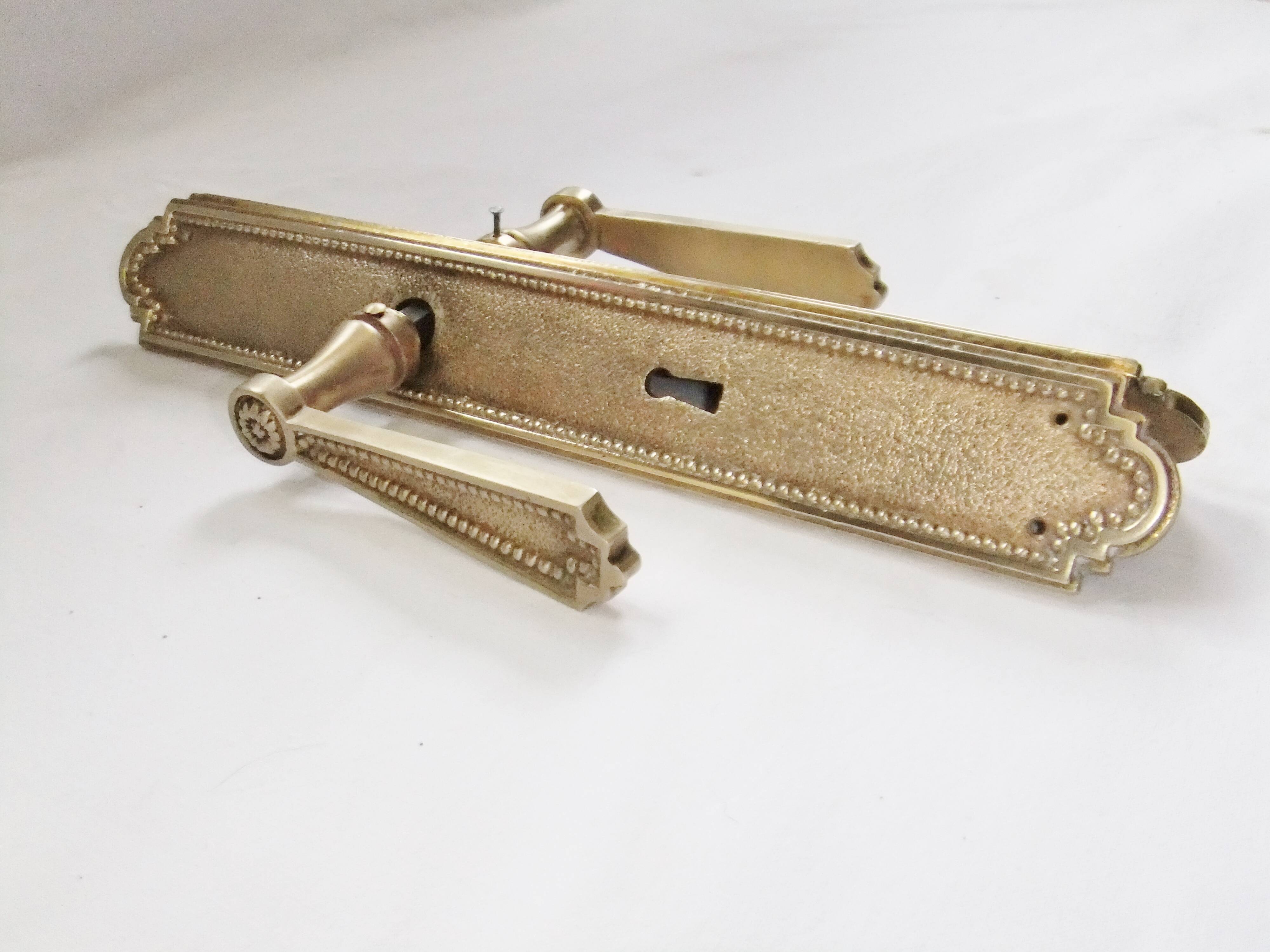 Pair of Louis XVI style beaded bronze door handles