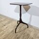 Antique octagonal mahogany side table on a classic tripod, 19th century.