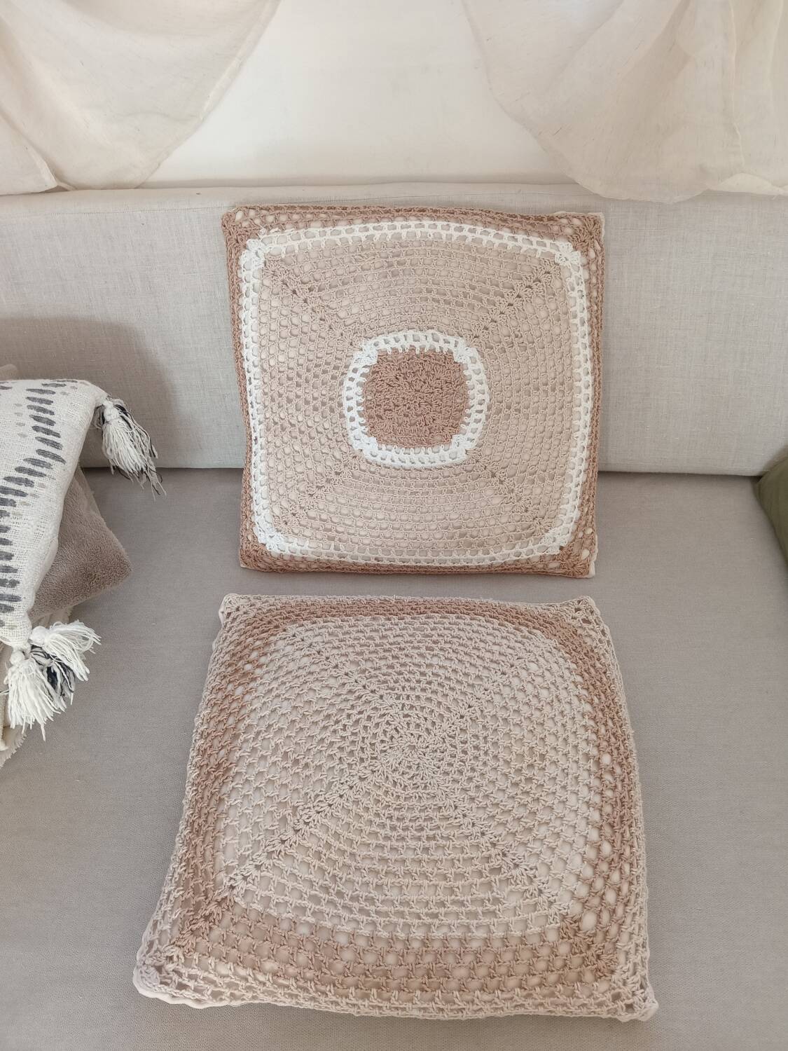 Pair of crocheted cushions