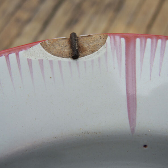 Old faience plate with wall support: blueberry decor