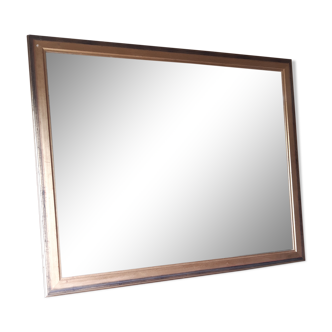 Old mirror of period handmade by cabinetmaking and decorated with gold leaf