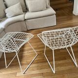 2 white Bertoia chairs