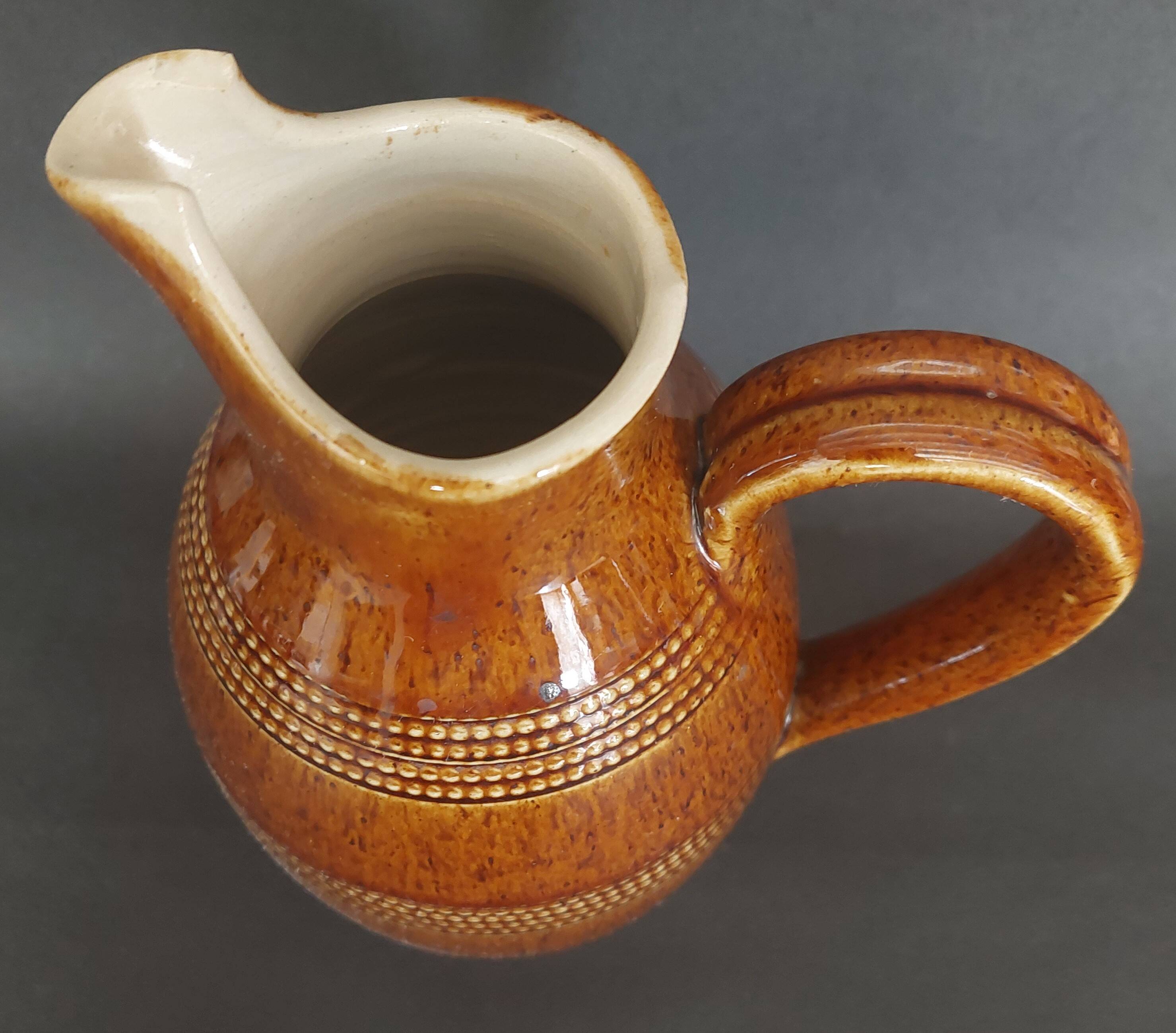 Mid-20th century brown glazed stoneware wine pitcher
