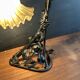 Art Nouveau wall light in wrought iron with vine decoration, early 20th century.