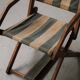 Foldable chair in solid wood and striped fabric, circa 1900.