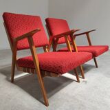 Pair of armchairs in mottled red and wood by Uluv, former Czechoslovakia 1960