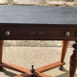 Antique black wooden console, central drawer and turned legs, 19th-century style.