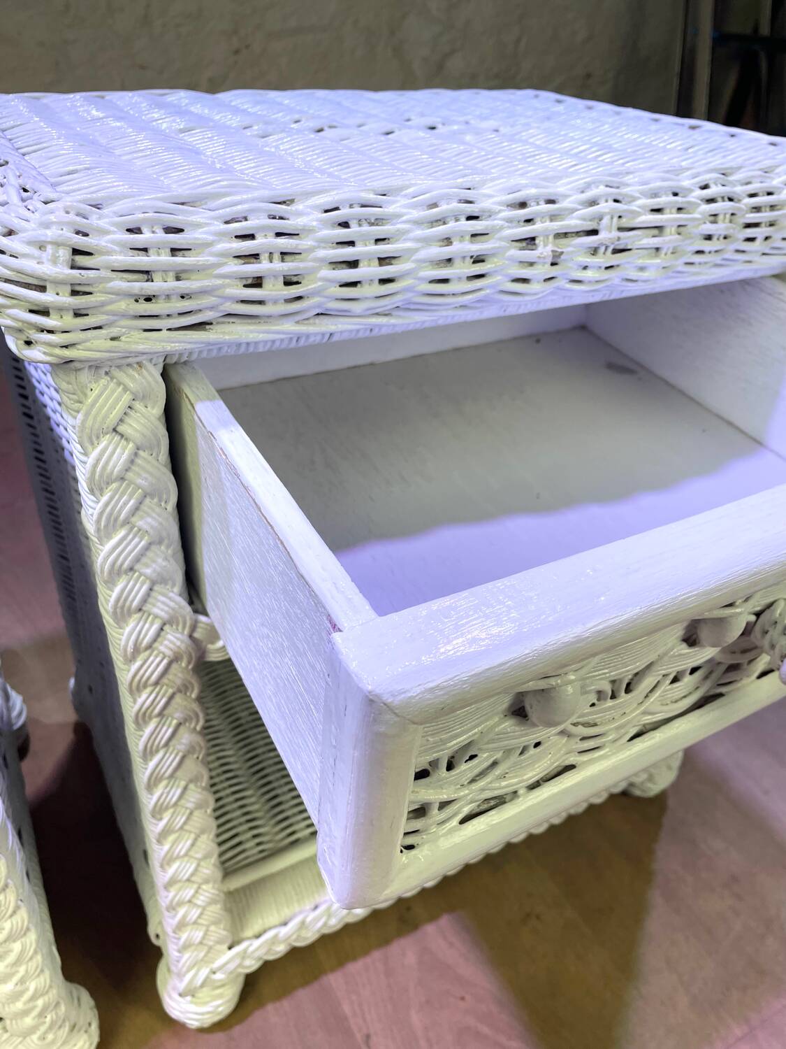 Pair of white lacquered rattan bedside tables