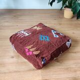 Brown Berber pouf with bohemian patterns