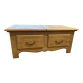 Oak coffee table with sliding storage space.