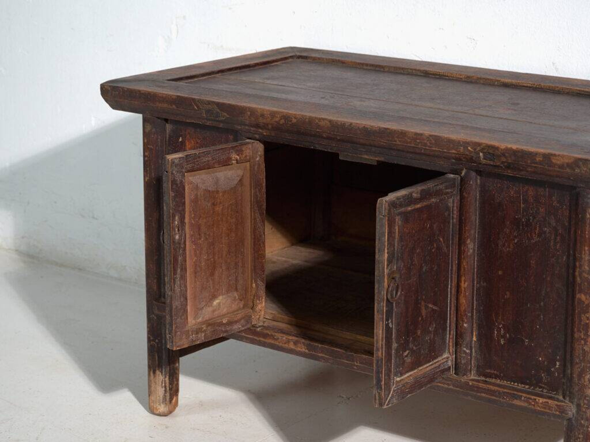 Chinese low altar cabinet with two doors and dark patina – China, around 1900