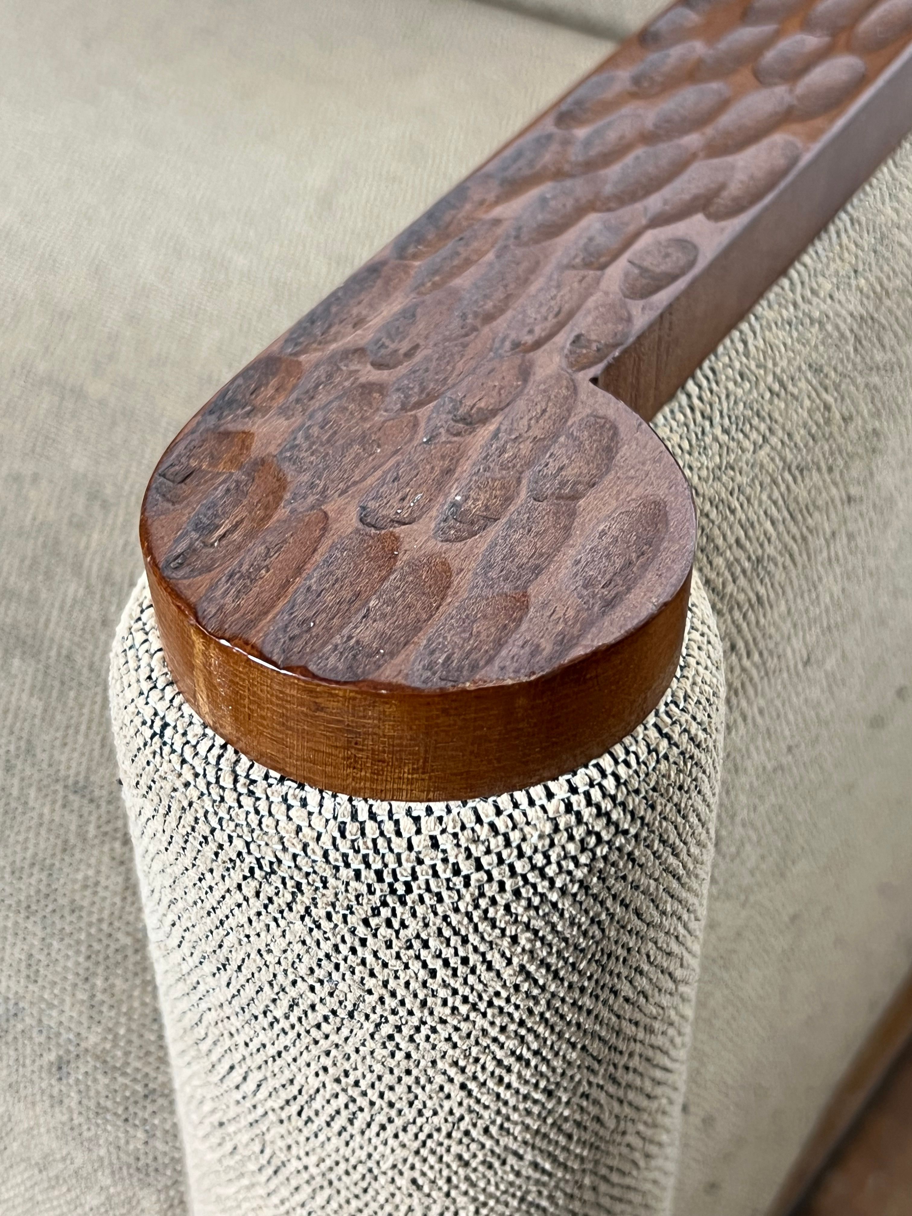 Pair of armchairs in carved wood and vintage fabric