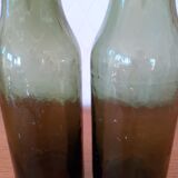 Pair of green bottles made of bubbled blown glass