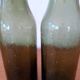 Pair of green bottles made of bubbled blown glass