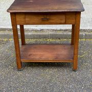 Vintage farmhouse dessert trolley on wheels made of solid wood from the 19th century.