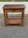 Vintage farmhouse dessert trolley on wheels made of solid wood from the 19th century.