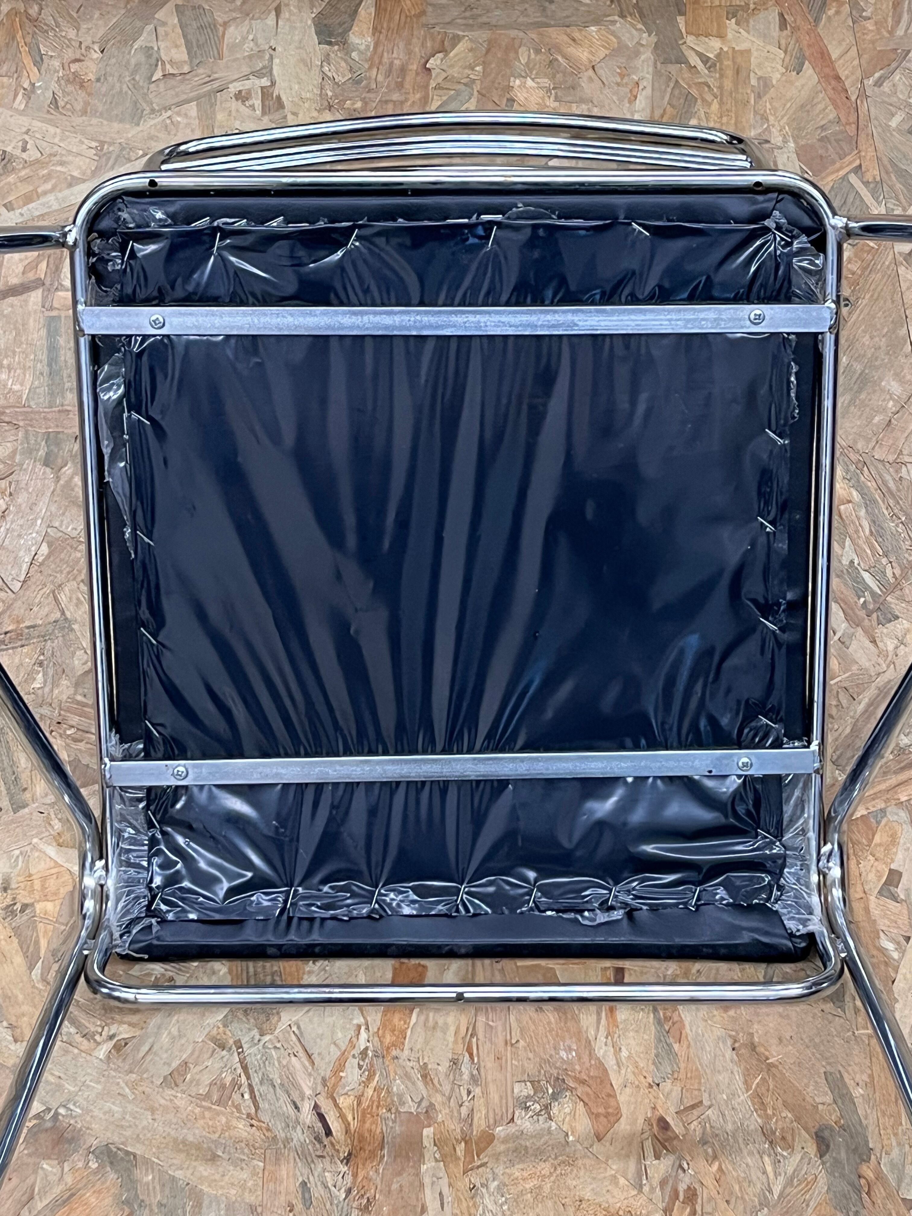 Three chrome and skai chairs from the 70s