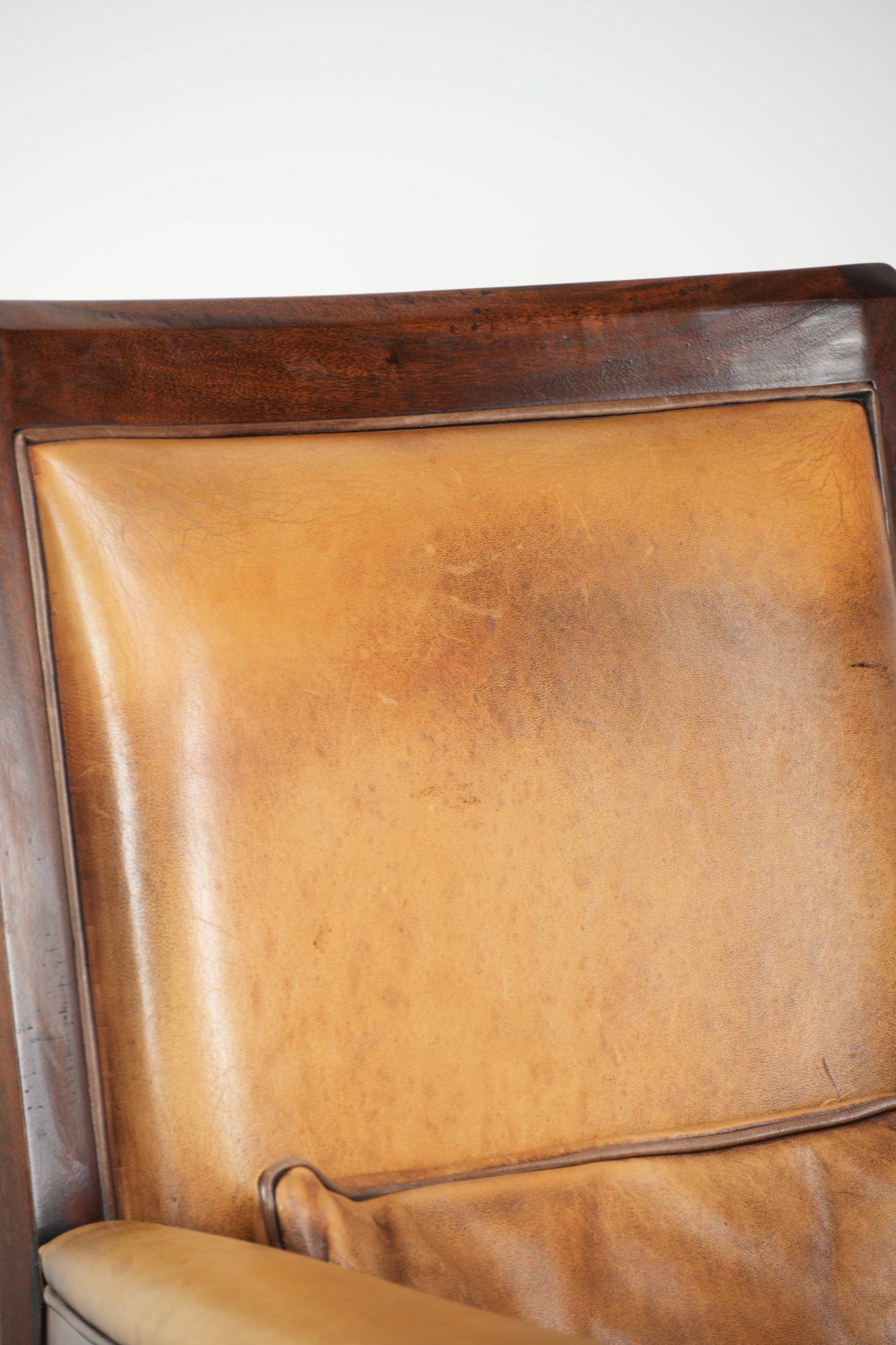 Cognac-coloured Art Deco design armchair made of sheepskin with a high back