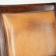Cognac-coloured Art Deco design armchair made of sheepskin with a high back
