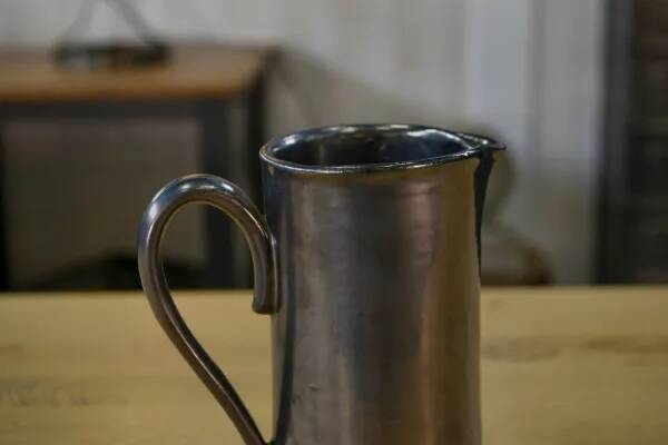 Black ceramic pitcher 1950s