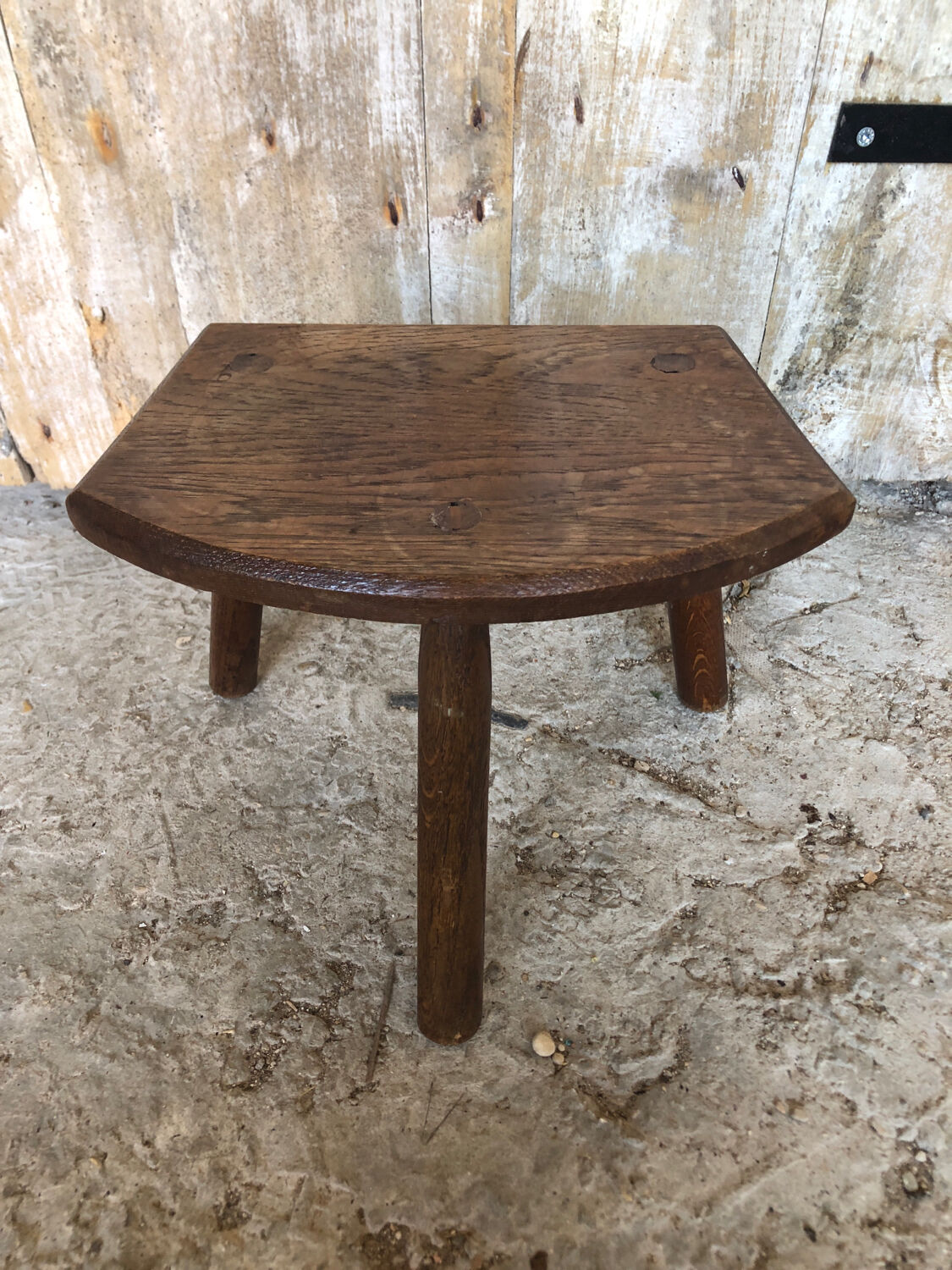 Old vintage wooden tripod milking stool