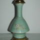 Art-new lamp foot in enamelled earthenware and bronze