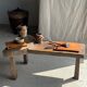 Small rectangular teak monoxyle cutting board with a circular handle.