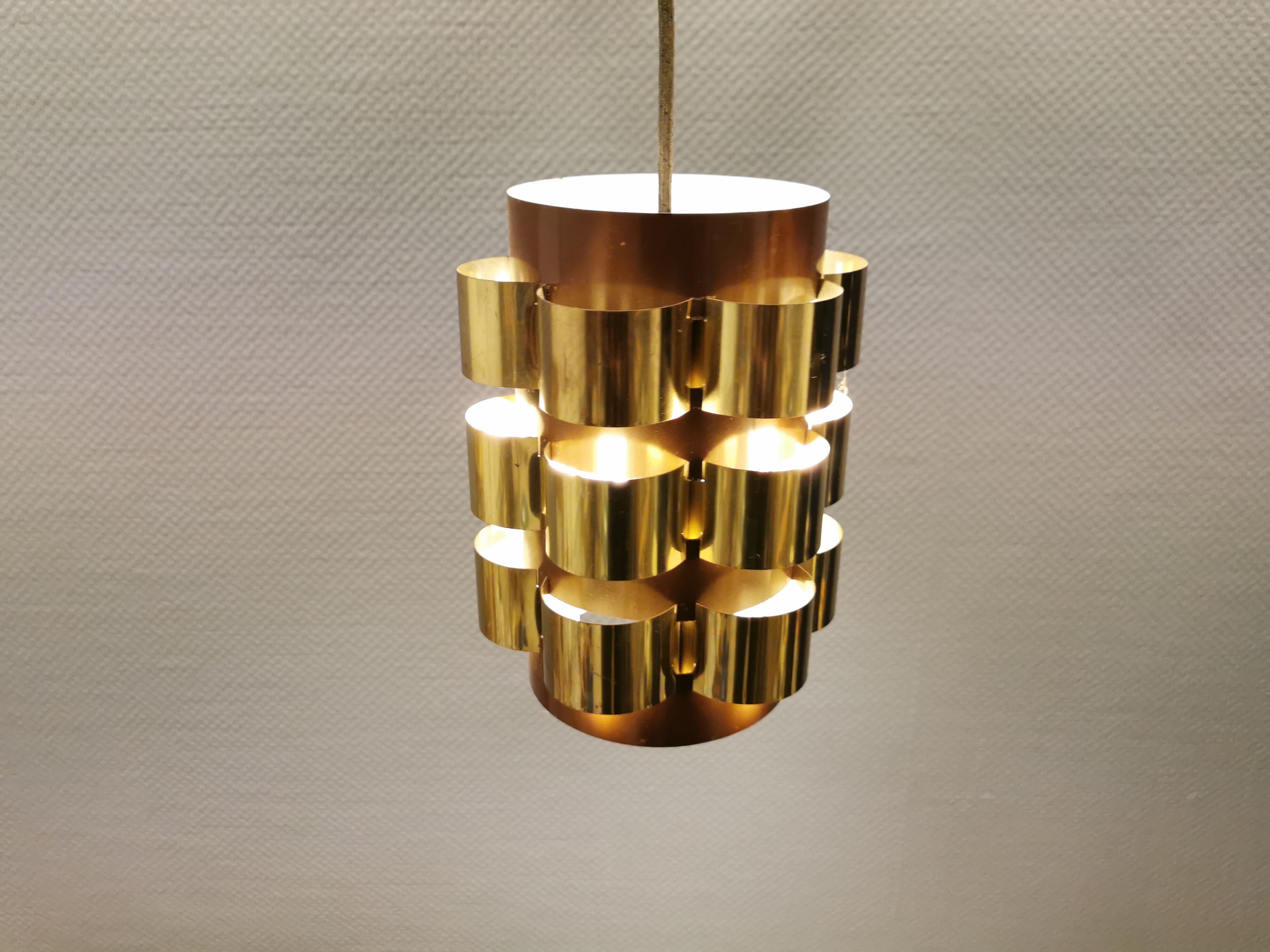 Danish hanging lamp from the 70s, in thin cut metal.