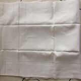 Old white tablecloth in thread with tangles of embroidered days central monogram