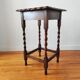 Antique solid oak side table with turned wooden legs.