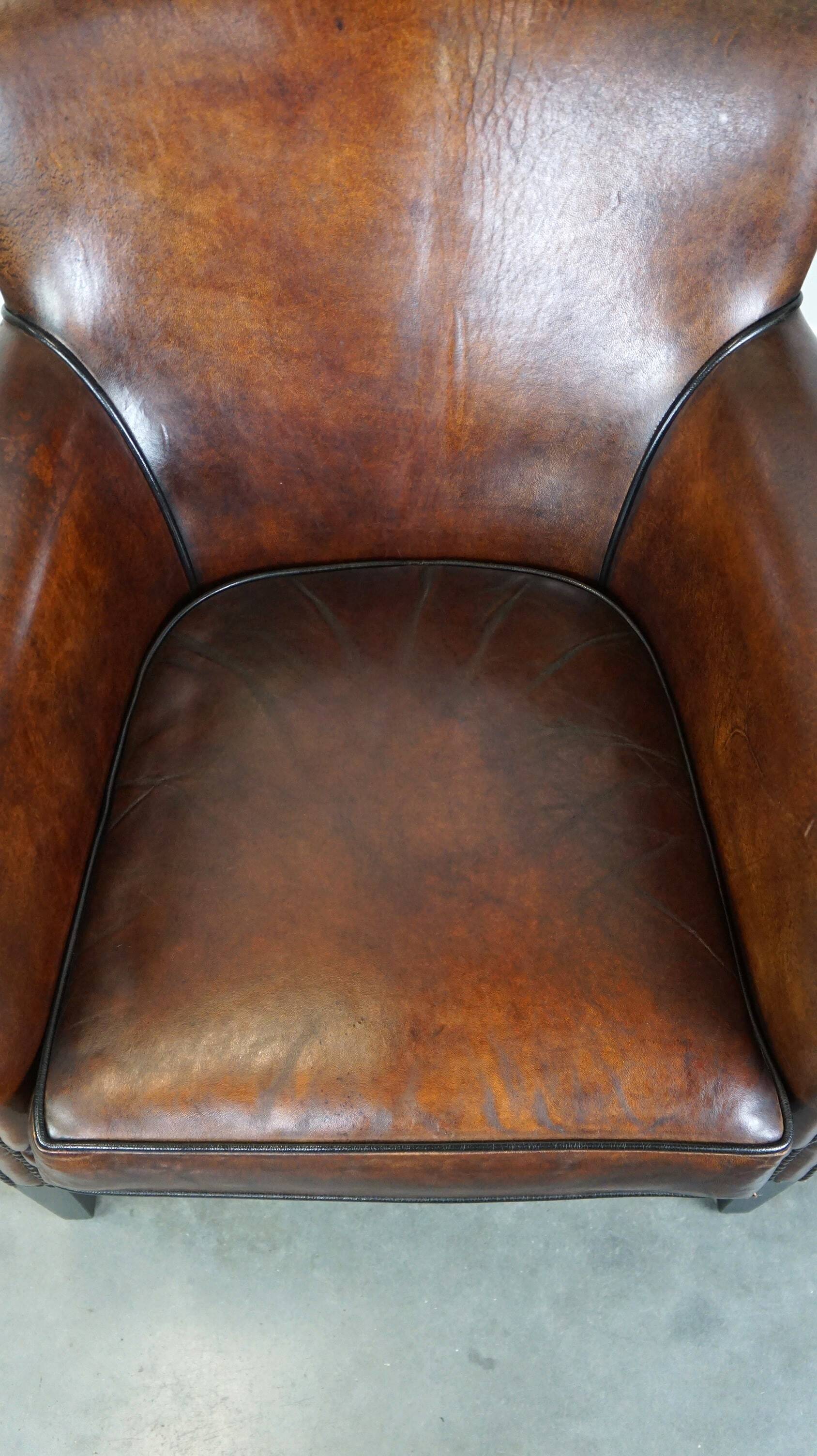 Stylish sheepskin leather armchair with a refined appearance