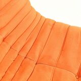 Togo sofa set and armchairs in pumpkin orange, 3 pieces, no label.