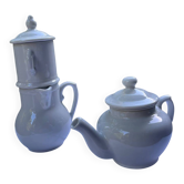 Antique white earthenware teapot, individual service with filter.