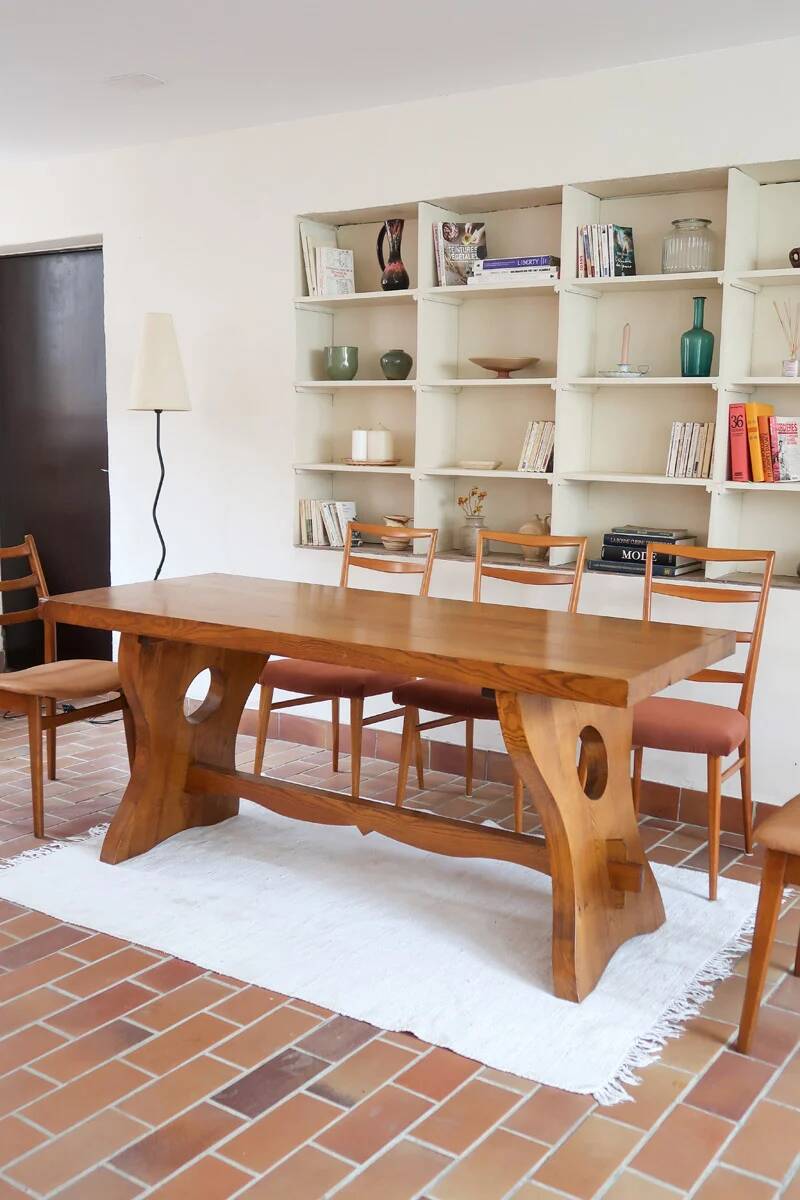 Solid wood dining table, sculpted brutalist base, 1960s.