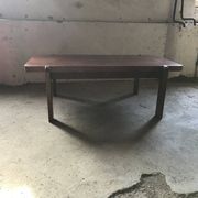 Mid-century coffee table in brown wood from the 1970s, rectangular top with rounded corners.
