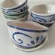 7 stoneware bowls with blue and green ocean-inspired decoration