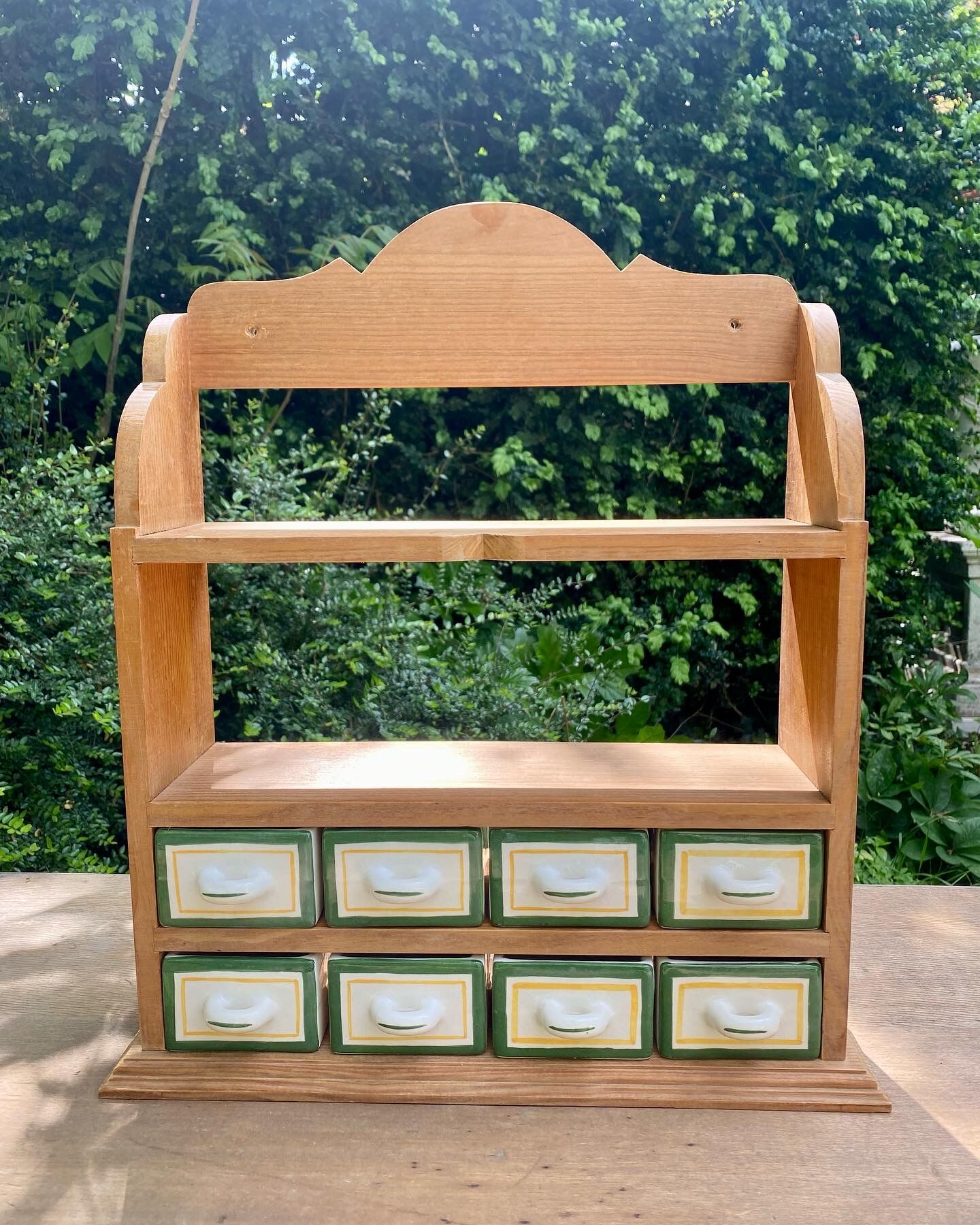 Wooden shelf and spice earthenware